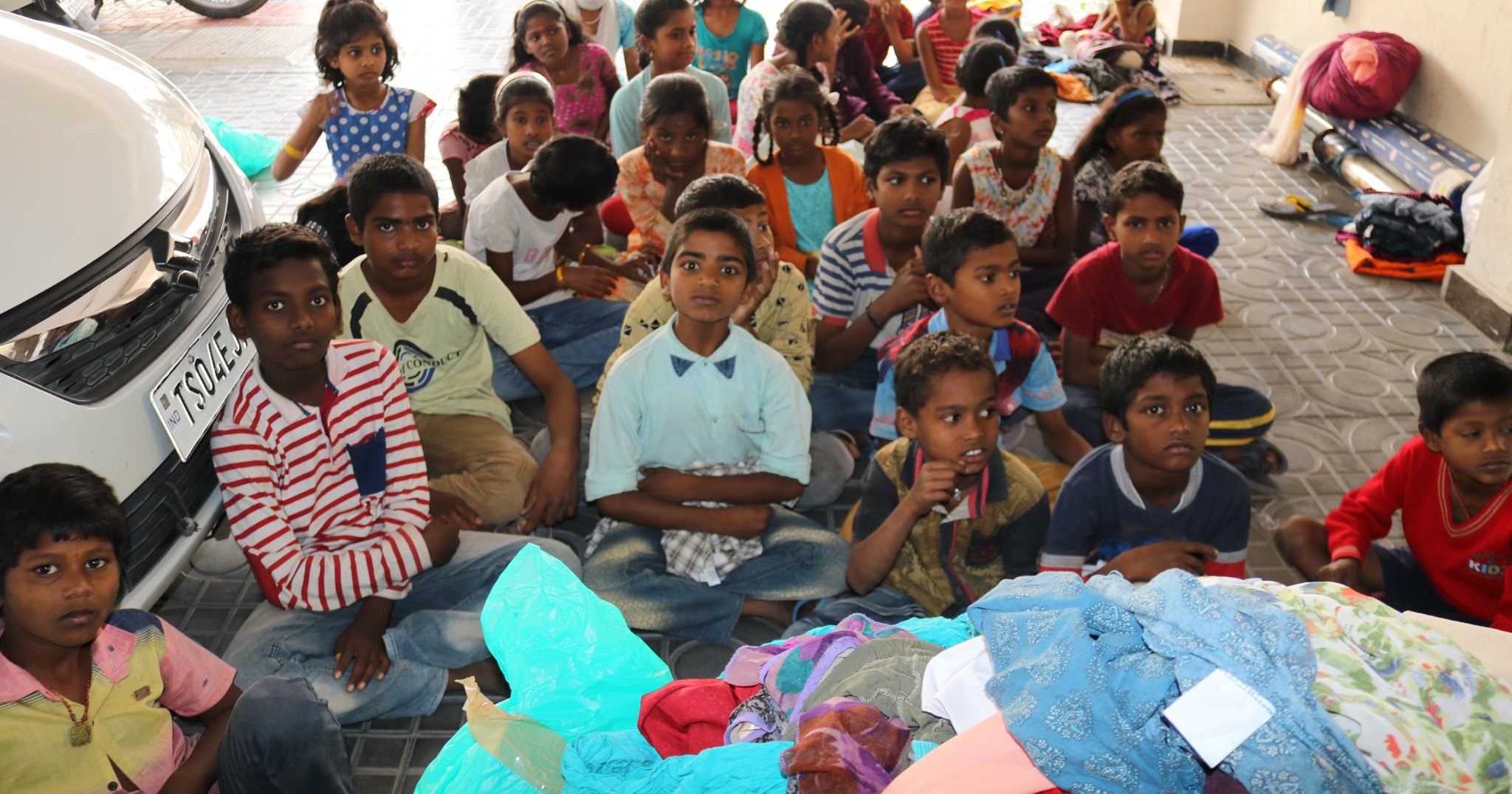 Clothes  distribution to slum kids at Pokkalawada, Manikonda, Hyderabad on 05-Feb-2020.
